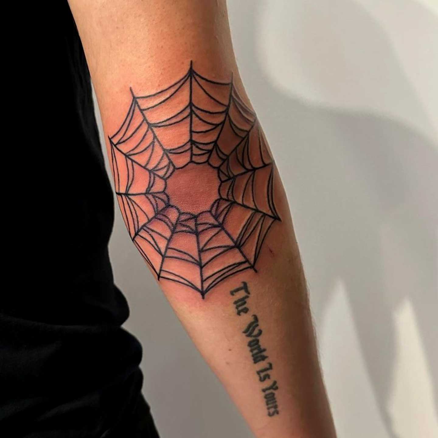 Spider Web Tattoo on Elbow Meaning