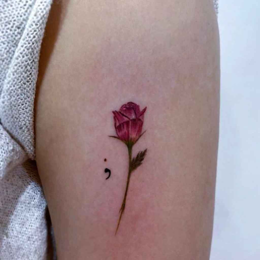 semicolon forming the stem of a rose
